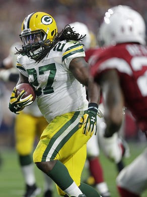 Green Bay Packers running back Eddie Lacy (27) finds room to run against the Arizona Cardinals in the third quarter at University of Phoenix Stadium.