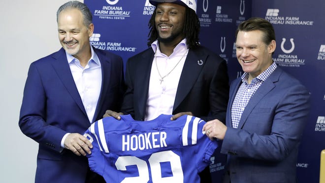 Indianapolis Colts first round draft pick Malik Hooker, center, holds a jersey with head coach Chuck Pagano, left, and general manager Chris Ballard during an NFL football news conference Friday, April 28, 2017, in Indianapolis