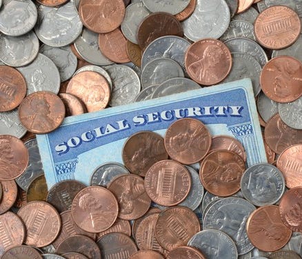 Social Security card embedded in coins.