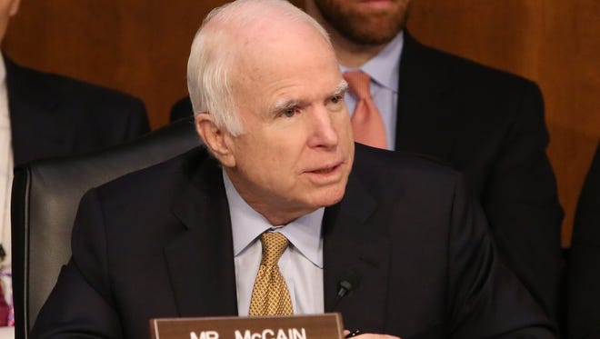 Sen. John McCain listens to former FBI director James Comey at a Senate Intelligence Committee hearing on June 8, 2017, in Washington, D.C.