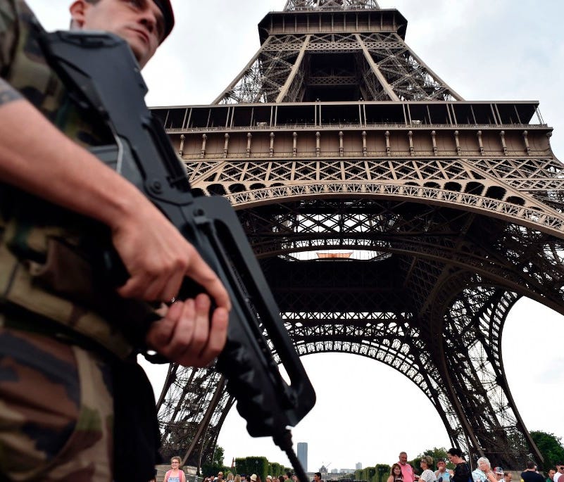 This file photo taken on July 20, 2016, shows an armed French soldier patrolling under the Eiffel tower in Paris.
