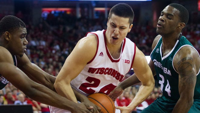 Bronson Koenig fights for the ball against Green Bay in this Dec. 2015 file photo.