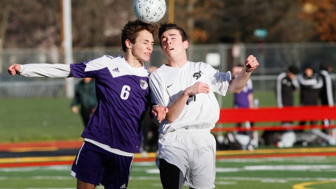 Shasta High's Logan Coots, left, and Chico High's Hill Hardy fight for the header during a Northern Section Division I semifinal Wednesday in Chico. Shasta lost 3-2.