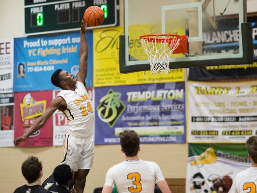York Catholic's Melik Martin drives to the basket against