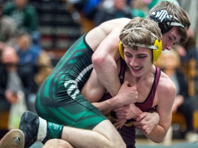Brandon Baltz of Nathan Hale makes a reverse move on