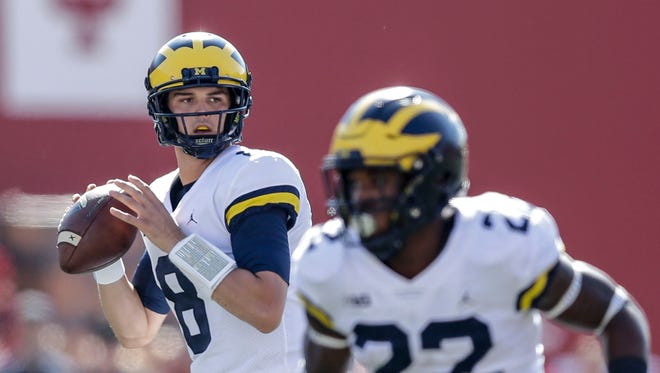 Michigan quarterback John O'Korn drops back to throw during the first half against Indiana in Bloomington, Ind., Saturday, Oct. 14, 2017.