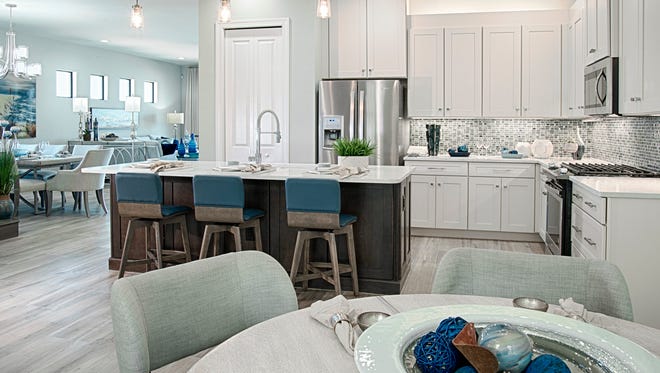The Dolce model features a kitchen with a café and a breakfast bar at the island counter.