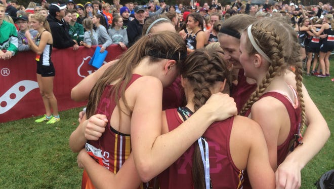 The Luxemburg-Casco girls cross-country team celebrates after being announced as the WIAA Division 2 state runner-up Saturday at Wisconsin Rapids.