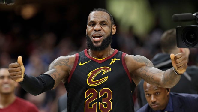 Cleveland Cavaliers' LeBron James celebrates after scoring the game-winning shot in the second half of Game 5 of an NBA basketball first-round playoff series against the Indiana Pacers, Wednesday, April 25, 2018, in Cleveland. The Cavaliers won 98-95.
