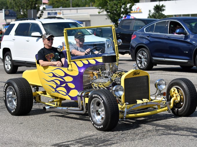 A custom Ford hot rod sports a bright paint job during