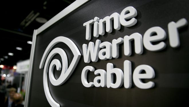 The Time Warner Cable Inc. logo is seen on the exhibit floor during the National Cable and Telecommunications Association (NCTA) Cable Show in Washington, D.C., U.S., on Tuesday, June 11, 2013.
