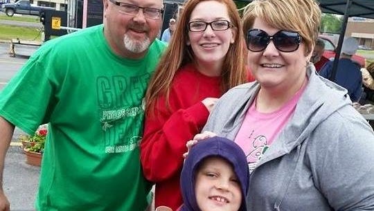 Chris Wrinkle (far left) died suddenly last fall. Pictured with him is his daughter Karsen, his son Kasen, and his wife Kim. Since his death, his family has found support at the Lost & Found Grief Center.