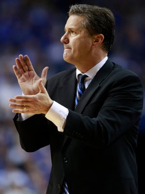 
Kentucky head coach John Calipari cheers on his team in the second half of the Dec. 28, 2014, U of L-UK game at Rupp Arena.
