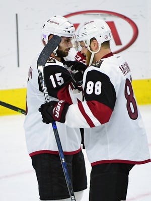Arizona Coyotes right wing Brad Richardson (15) and left wing Jamie McGinn (88) celebrate win against Philadelphia Flyers at Wells Fargo Center. The Coyotes defeated the Flyers, 5-4, Oct. 27, 2016.