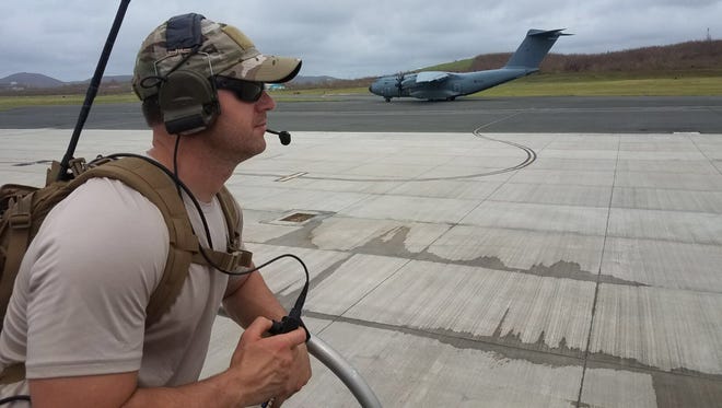 Master Sgt. Harley Bobay, a combat controller with the Kentucky Air National Guard’s 123rd Special Tactics Squadron, provides air traffic control to planes delivering relief supplies to Henry E. Rohlsen Airport on St. Croix, U.S. Virgin Islands, Sept. 22, 2017. Bobay deployed to the Caribbean to support recovery operations following Hurricane Maria.