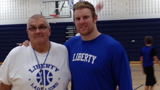 Brennen Beyer (right) is thrilled about reuniting with coach Mark LaPointe with Liberty Middle School's girls basketball team. Beyer, who plays in the NFL, said LaPointe was a major influence on his life when both were at now-closed Central Middle School in Plymouth.