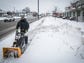 Gavin Greene clears a sidewalk on Madison Street Saturday