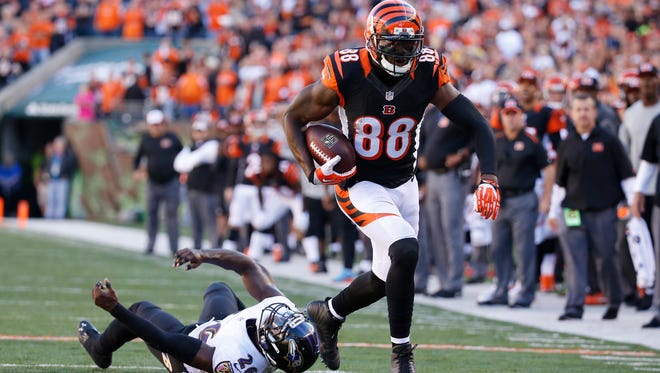 Cincinnati Bengals wide receiver Greg Little (88) runs the ball after a reception past the Baltimore Ravens strong safety Matt Elam (26) in their final drive of the game at Paul Brown Stadium.  The Enquirer/Jeff Swinger