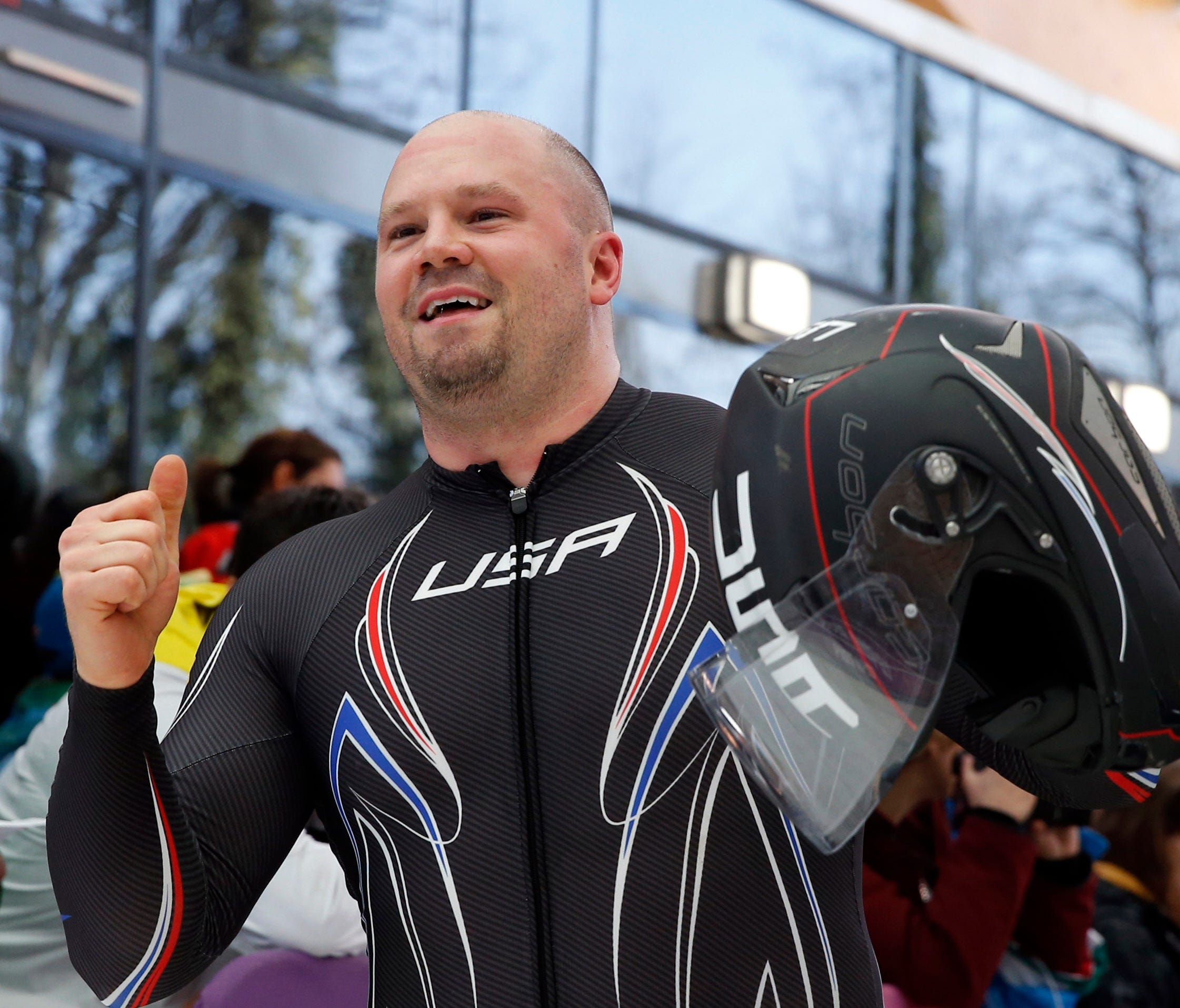 Steven Holcomb reacts after heat 4 of men's four-man bobsled during the Sochi 2014 Olympic Winter Games in 2014.