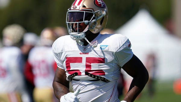 San Francisco 49ers defensive end Dee Ford jogs on