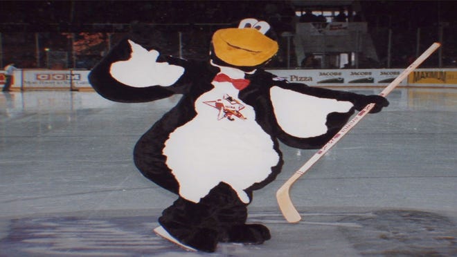 The Red Penguins mascot gets goofy.