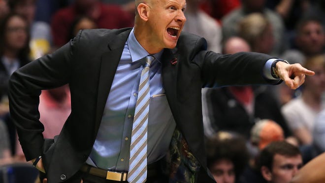 Friday, March 16, 2018: Xavier Musketeers head coach Chris Mack interacts the team in the first half of the first-round NCAA Tournament game between the Xavier Musketeers and the Texas Southern Tigers at Bridgestone Arena in Nashville.