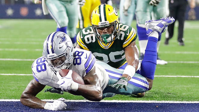Wide receiver Dez Bryant beats cornerback LaDarius Gunter for a touchdown during the Packers' playoff win over the Cowboys at AT&T Stadium in Arlington, Texas on Jan.15, 2017.