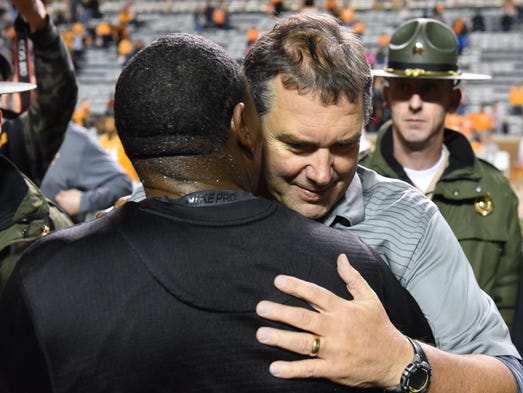 Tennessee Interim Head Coach Brady Hoke hugs Vanderbilt