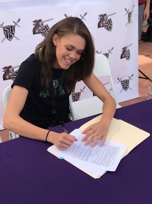 Trinity Castaneda of Shadow Hills signs her letter of intent to play volleyball at the University of Hawaii.