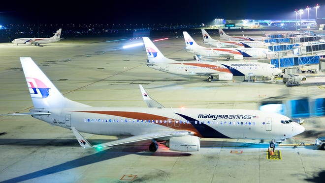 Malaysia Airlines planes are seen at the carrier's hub in Kuala Lumpur in June 2016.