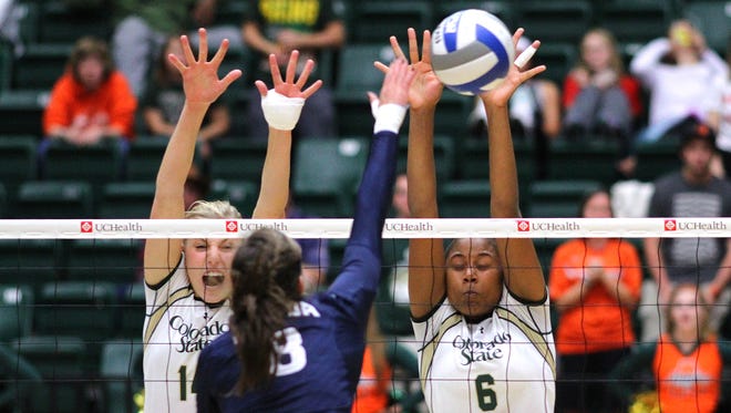 Alexandra Poletto and Jasmine Hanna make a block during Colorado State's sweep of Nevada last week. The Rams face Air Force at 6:30 p.m. Thursday.