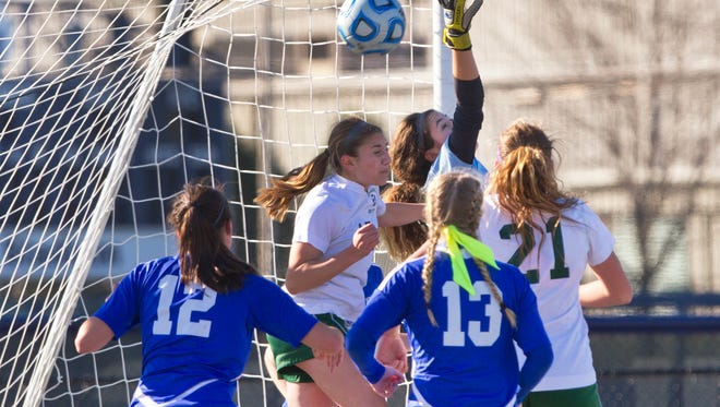 Holmdel goalie Mattie Milkowski reaches back can't stop a shot on goal that was eventually kicked in for Ramapo's second goal in their 2-0 win over Holmdel. Holmdel Girls Soccer vs Ramapo in NJSIAA State Group II Championship at Kean University on November 21, 2015 in Union, NJ. 