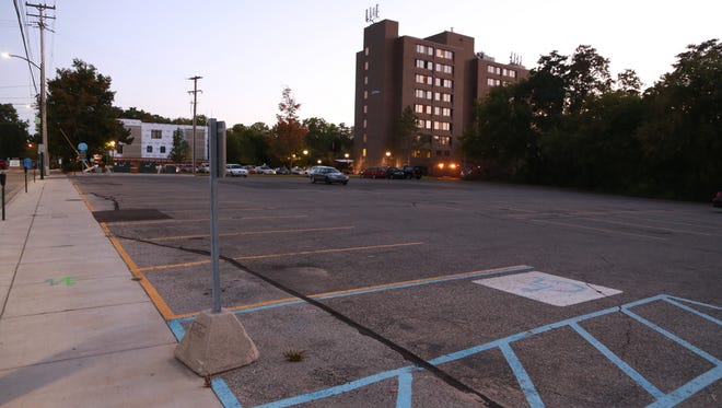 The parking lot where a proposed nine-story condo building Pine Street Development would be built on the edge of downtown Traverse City.