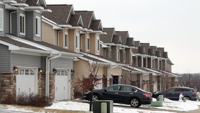 A row of homes is seen on Sara Court in North Liberty on Monday, Jan. 11, 2016. The city has increased in population by roughly 36 percent since 2010.