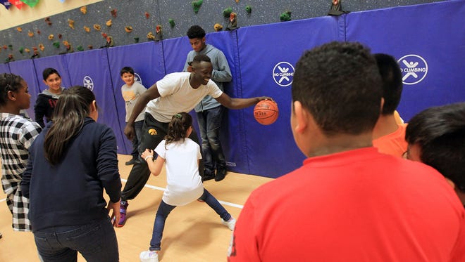 Iowa's Peter Jok plays basketball with Kirkwood Elementary students on Wednesday, April 20, 2016. Jok spent part of the afternoon speaking to English language learners about his early childhood as a Sudanese refugee.
