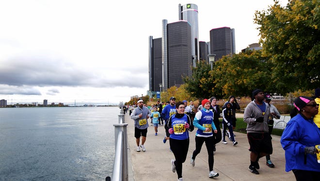 Runners keep the pace during the American Home Fitness 5K as a part of the Detroit Free Press/Talmer Bank Marathon along the Detroit Riverwalk in Detroit 