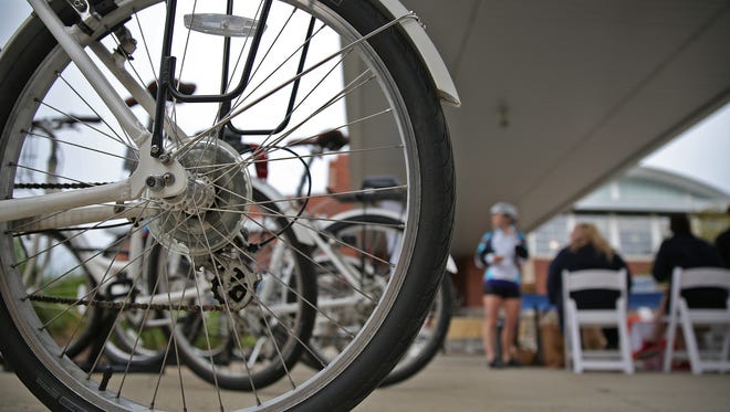 Zagster bikes are available for people who join Zagster.com to borrow, await riders at the Monon Community Center, as people ride by and stop for a break on National Bike to Work Day, Friday, May 20, 2016.  