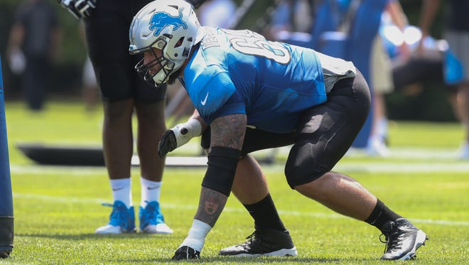 Lions offensive lineman Taylor Decker takes part in drills during training camp Sunday at the practice facility in Allen Park.