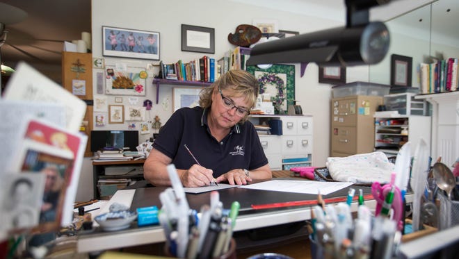 Vicki Corwin, 61, is an independent calligrapher that works out of her living room she converted into an art studio at her home in Royal Oak, Mich., photographed on Monday, Aug. 8, 2016. Corwin uses a pointed pen split nib to write her calligraphy and is a member of the Michigan Association of Calligraphers.