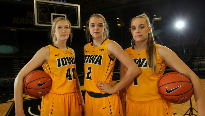 Iowa seniors, from left, Hailey Schneden, Ally Disterhoft and Alexa Kastanek pose for a photo during media day at Carver-Hawkeye Arena on Wednesday, Oct. 26, 2016.