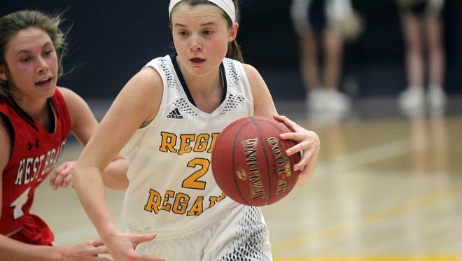 Regina's Mary Crompton drives to the hoop during the Regals' game against West Branch at Regina on Friday, Dec. 16, 2016.