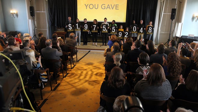 Guests applaud as they learn of the near $2 billion raised during the "For Iowa. Forever More." campaign at the senate chambers of the Old Capitol Museum on Monday, Feb. 6, 2017.