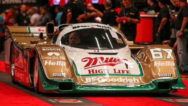 A 1989 Porsche 962, a Daytona 24 Hour winner, driven by Derek Bell Bob Wollek and John Andretti, is auctioned off at the 30th annual Mecum Auctions, Indiana State Fairgrounds, Indianapolis, Friday, May 19, 2017. The bids sat at $2,000,000 Friday afternoon.