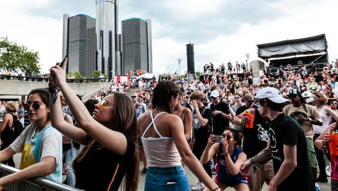 Festival attendees take photos as Dru Ruiz performs on the main stage on the third day of the Movement Electronic Music Festival at Hart Plaza, Monday, May 29, 2017 in Detroit.