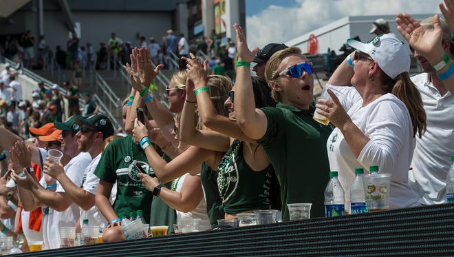 Fan on the New Belgium porch celebrate after a Dalyn Dawkins touchdown in the second quarter, Saturday, August 26, 2017, at Sonny Lubick Field at Colorado State Stadium in Fort Collins, Colo.