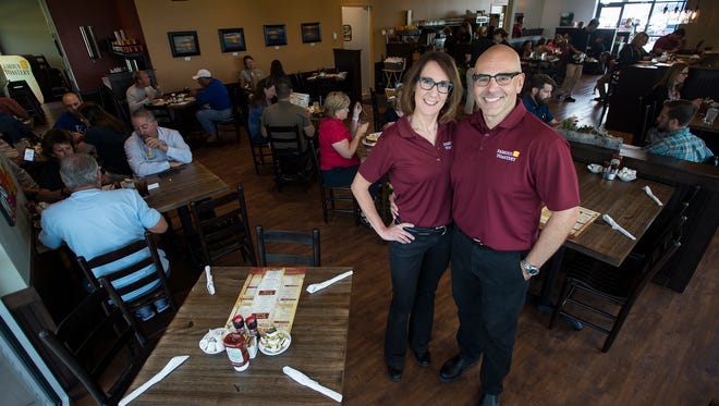 Husband and wife co-owners David Glista and Lisa Boesch pose for a portrait, Thursday, Sept. 7, 2017, at the soft-opening for the Famous Toastery on East Harmony Road in Fort Collins, Colo.