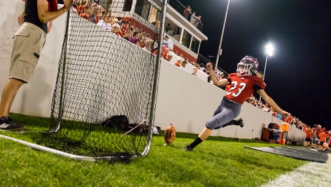 Port Huron kicker Lily Hurtubise warms up during the third quarter of the Big Reds' game against Fraser High School, Sept. 22.