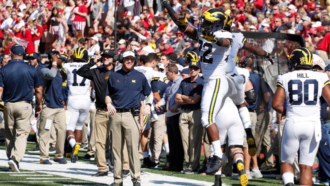 Michigan running back Karan Higdon celebrates after scoring a touchdown against Indiana on Saturday. Higdon scored three times against the Hoosiers.