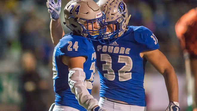 Poudre High School receiver Dylan McVicker (24) celebrates with running back JT Erickson (32) after a touchdown earlier this season. The Impalas are the No. 13 seed in the Class 5A playoffs.