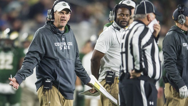CSU head coach Mike Bobo looks for clarification from an official after a call against the Rams during the first half of a Homecoming game against Nevada on Saturday night, Oct. 14, 2017, on campus in Fort Collins, Colo.